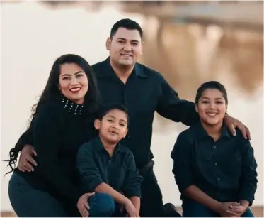 a family posing for a picture in front of a lake, VINSA Assurance LLP
