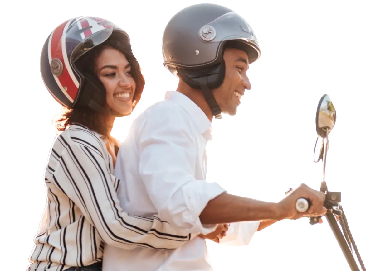 A couple riding a bike is ensured by their health insurance