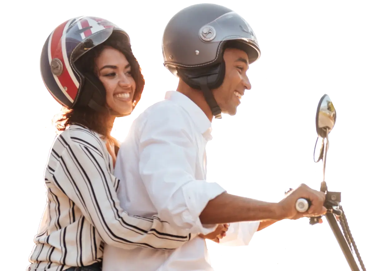 A couple riding a bike is ensured by their health insurance